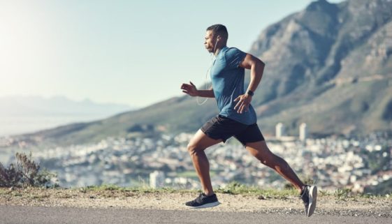 athletes running on a road