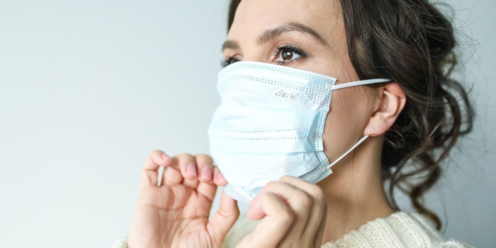 Woman wearing mask during pandemic.