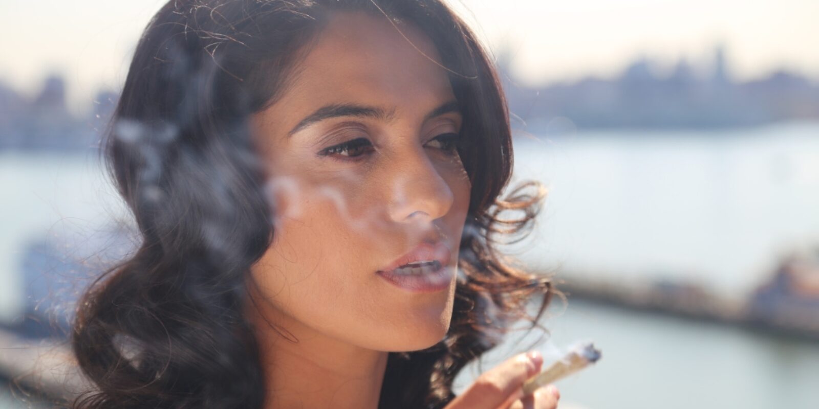 Woman smoking marijuana.